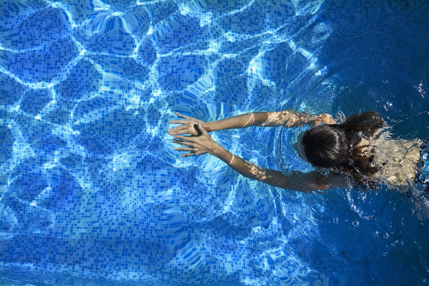 Woman swimming in the pool